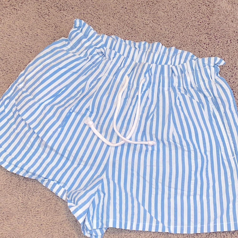 Blue and white paper bag style shorts